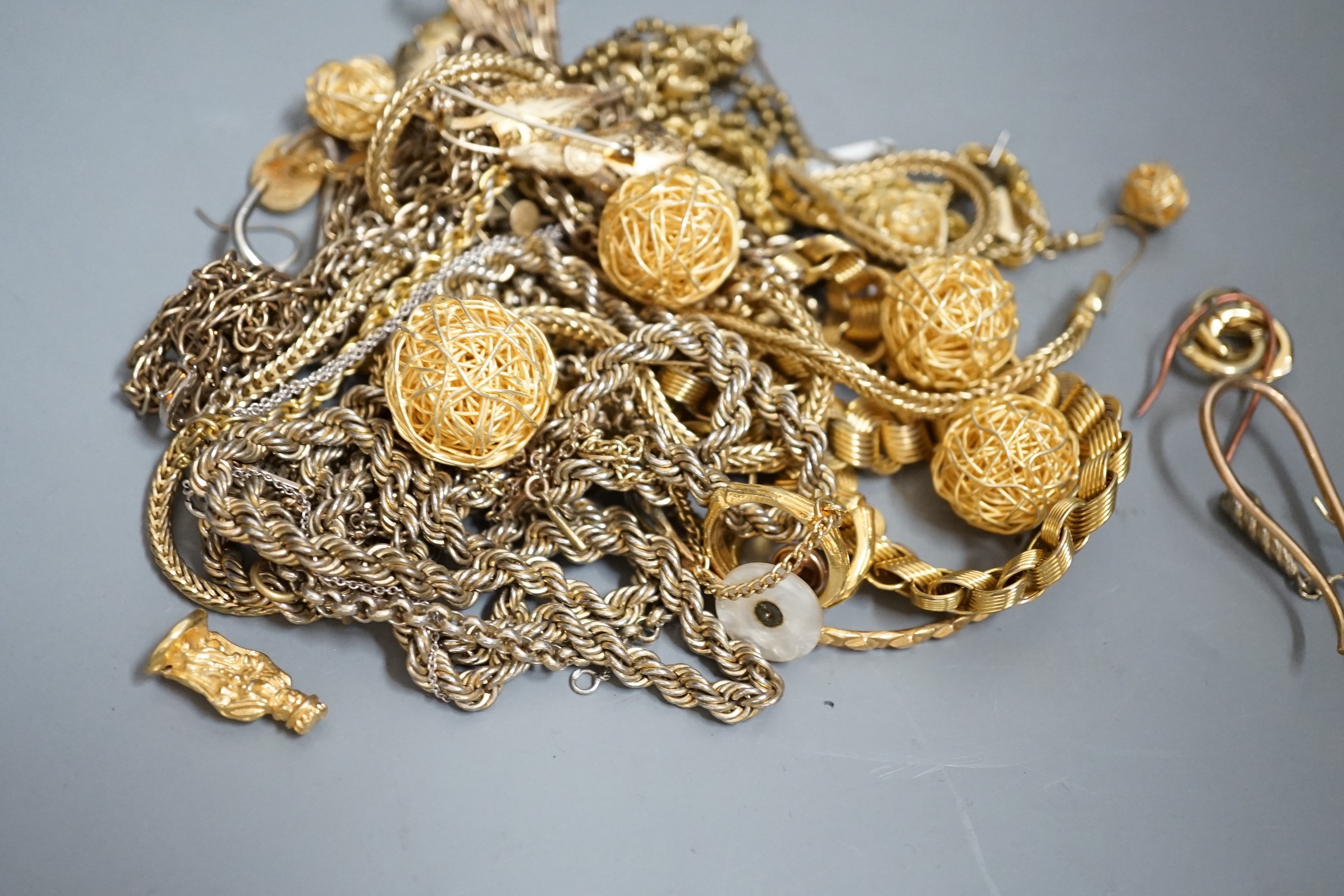 A group of assorted mainly gilt metal costume jewellery.